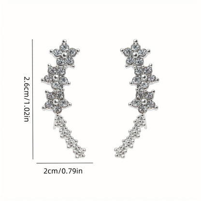 | BOUCLES D’OREILLES FLORALES INTEMPORELLES