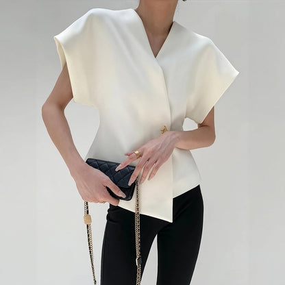 Nicoletta – Top Elegante con Detalle Nudo y Mangas Estructuradas