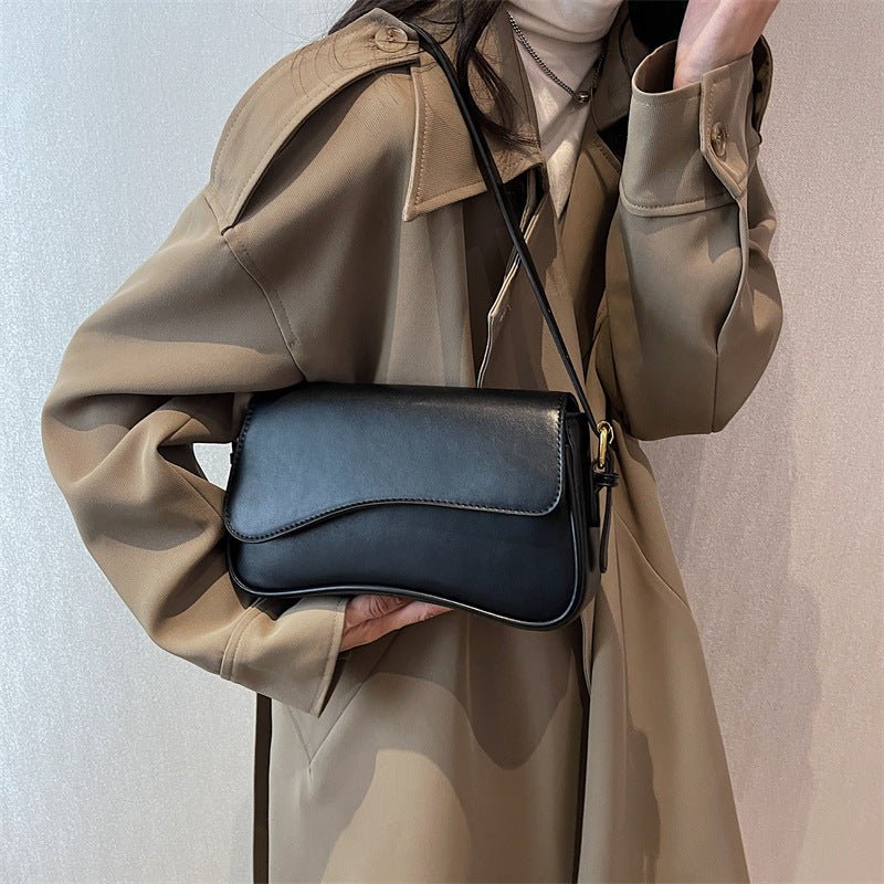 BOLSA DE SILLÍN ELEGANTE Y VERSÁTIL